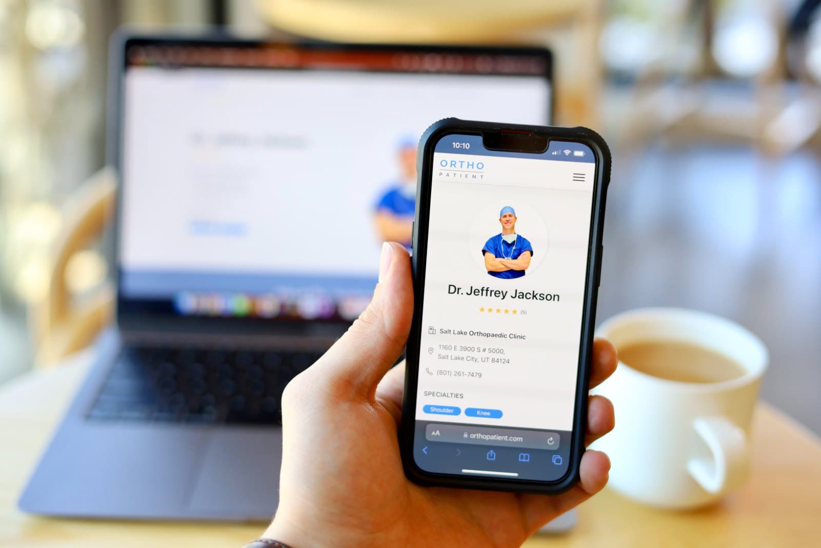 A client site loading on a phone and laptop